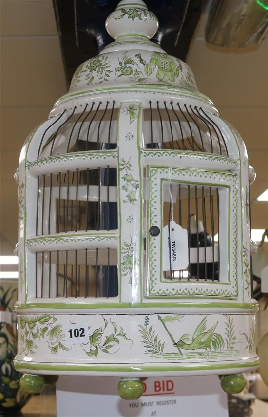 A Continental pottery hanging lantern, white and pale green glazed with birds and flowers H.31cm